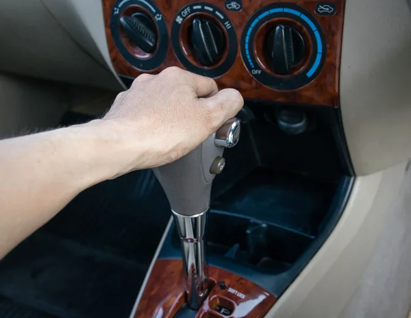 Hand on automatic gear shift — Stock Photo, Image