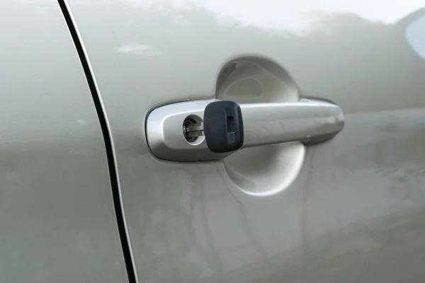 Open car door with key — Stock Photo, Image