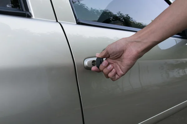 Open car door with key — Stock Photo, Image