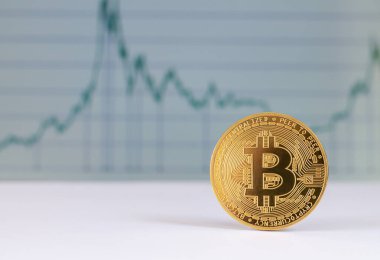 Grafik arkaplanındaki bitcoin. Sanal kripto para birimi kavramı