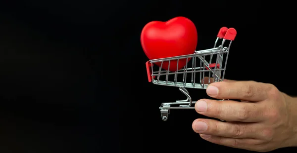 Man Holding Small Cart Red Heart Dark Background Valentine Day — Stock Photo, Image