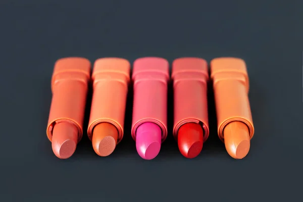 Five Different Lipsticks Dark Background Cosmetic Product Concept — Stock Photo, Image