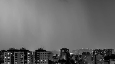 Images of the arrival of a strong summer storm with lightning and rain. Event in the city in the late afternoon, early evening in Niteroi, Rio de Janeiro, Brazil clipart
