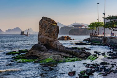Niteroi, Rio de Janeiro, Brazil - CIRCA 2021: Image of rock formations (stones), with texture and sharpness, on the beach during the day clipart