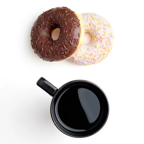 Чорна чашка і пончики — стокове фото