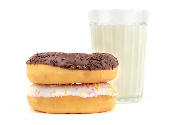 Glass of milk and donuts — Stock Photo, Image