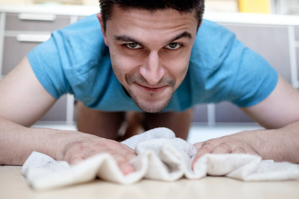 Man mopping the floor