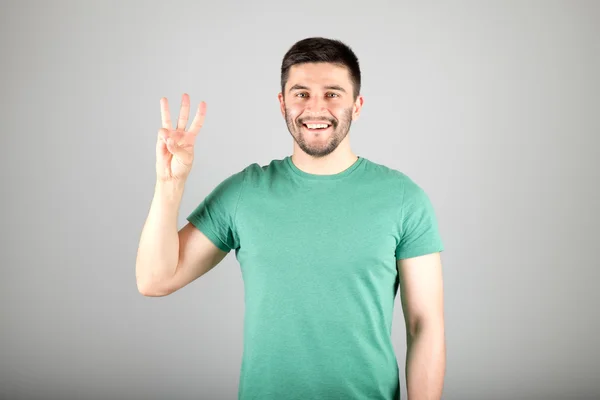 Чоловік, що показує число пальцями — стокове фото
