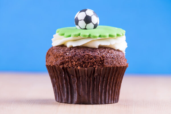 Delicious cupcake on table