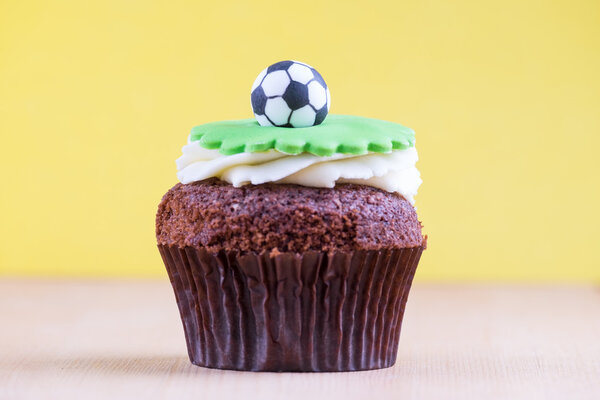 Delicious cupcake on table