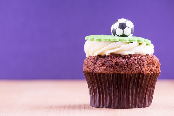 Delicious cupcake on table