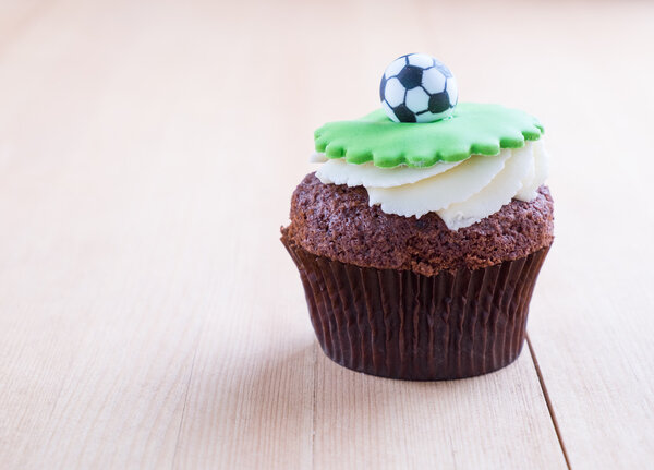 Delicious cupcake on table