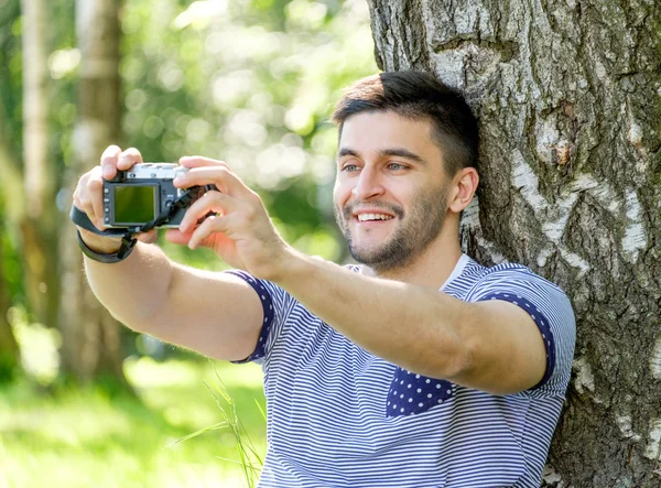 Hipster with camera — Stock Photo, Image