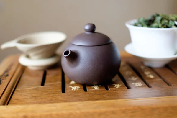 Teapot on the tea desk — Stock Photo, Image