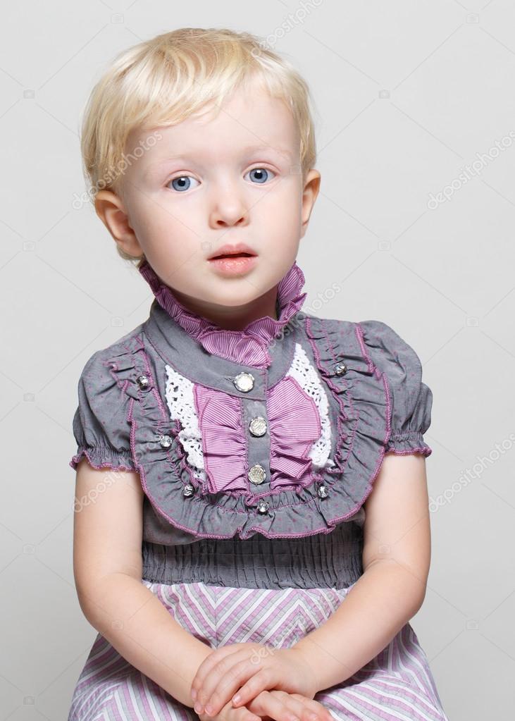Closeup Portrait Of Cute Child Toddler Girl With Blonde Hair And