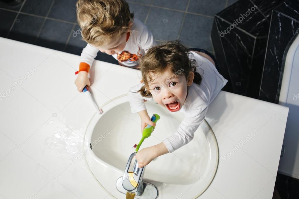 Closeup Portrait Of Twins Kids Toddler Boy Girl In Bathroom Toilet Washing Face Hands Brushing Teeth With Toothbrash Playing With Water Lifestyle Home Style Everyday Moments Top View Stock Photo Image Closeup Portrait Of Twins Kids Toddler Boy Girl In Bathroom Toilet Washing Face Hands Brushing Teeth With Toothbrash Playing With Water Lifestyle Home Style Everyday Moments Top View Stock Photo Image