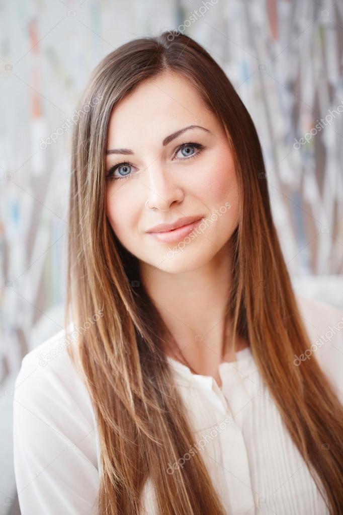 Closeup portrait of beautiful smiling nice young white Caucasian business woman with blue eyes long blond hair wearing white office blouse shirt, looking in camera, slavic Russian face Stock Photo by ©AnoushkaToronto Closeup portrait of beautiful smiling nice young white Caucasian business woman with blue eyes long blond hair wearing white office blouse shirt, looking in camera, slavic Russian face Stock Photo by ©AnoushkaToronto