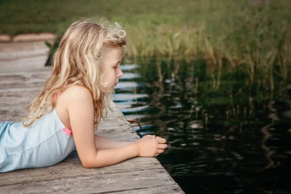 Cute Pretty Caucasian Blonde Girl Lying Wooden Dock Pier Lake — Stock Photo, Image