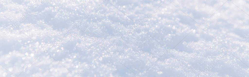 White snow winter texture. Christmas holiday background. Seasonal fresh snow nature backdrop wallpaper. First frost. Crisp sparkling textured ice frosty snow outdoor. Web banner header.