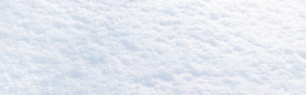 White snow winter texture. Christmas holiday background. Seasonal fresh white color snow nature backdrop wallpaper. Crisp shiny textured snow on sunny day outdoor. Web banner header. 
