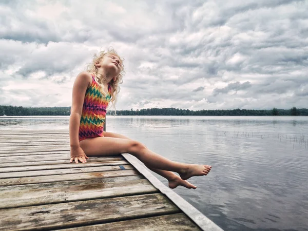Cute Adorable Blonde Caucasian Girl Sitting Wooden Dock Lake Looking — Stock Photo, Image