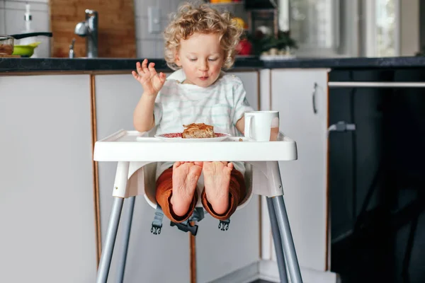 Cute Happy Caucasian Curly Kid Boy Sitting High Chair Eating — Stock Photo, Image