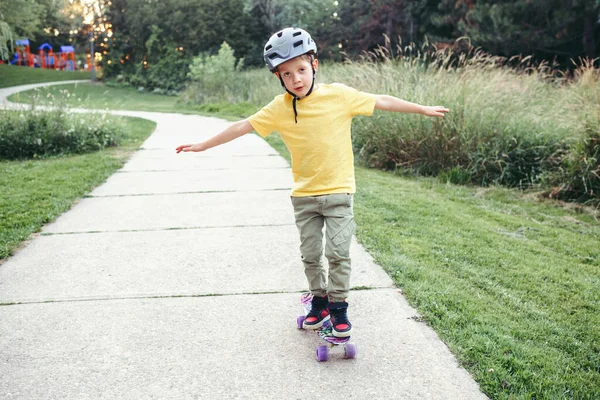 Happy Caucasian Boy Grey Helmet Riding Skateboard Road Park Summer Stock Picture