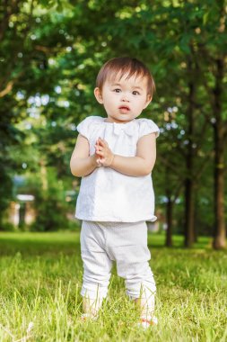 Portrait of asian baby clapping her hands