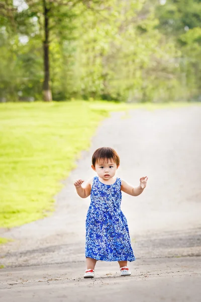 Portrait of cute Asian child playing in park — Stock Photo, Image