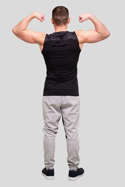 De man die Biceps handen omhoog laat zien. Sportman toont spierballen. ABS, Biceps Spieren. Geïsoleerde man — Stockfoto