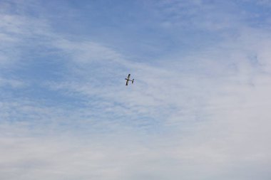 a model airplane flying in the sky