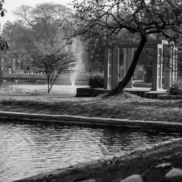 Fountain in the garden of Sunder Nursery in Delhi India, working fountain in the Sunder Nursery complex, water in the fountain, fountain in the park during morning time - Black and White