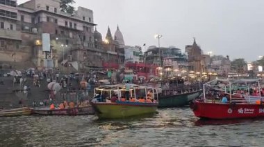 Varanasi, India - March 23 2025 - World famous various Ganga Ghats view from motor boat running in Ganga river, Spiritual Ganga Ghat view during evening time at old Varanasi city
