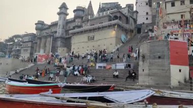 Varanasi, India - March 23 2025 - World famous various Ganga Ghats view from motor boat running in Ganga river, Spiritual Ganga Ghat view during evening time at old Varanasi city
