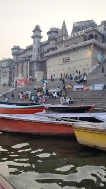 Varanasi, India - March 23 2025 - World famous various Ganga Ghats view from motor boat running in Ganga river, Spiritual Ganga Ghat view during evening time at old Varanasi city
