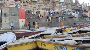 Varanasi, India - March 23 2025 - World famous various Ganga Ghats view from motor boat running in Ganga river, Spiritual Ganga Ghat view during evening time at old Varanasi city