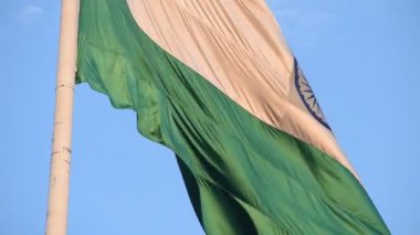 India flag flying high at Connaught Place with pride with plain white background, India flag fluttering, Indian Flag on Independence Day and Republic Day of India, tilt up shot, Har Ghar Tiranga