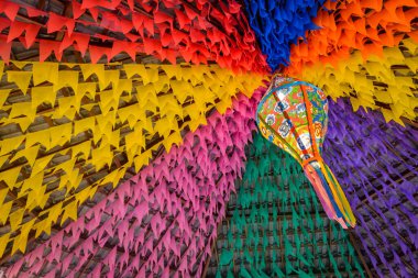 Colorful flags and decorative balloon for the Saint John party, which takes place in June in northeastern Brazil. clipart