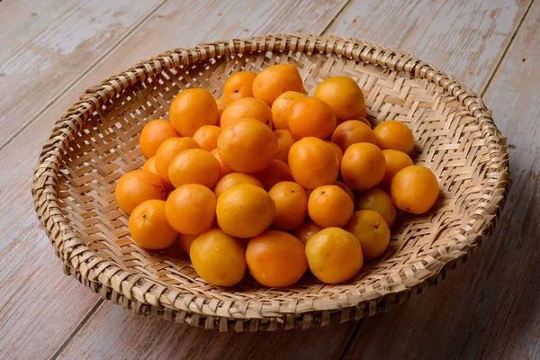 Brazilian fruit caja in the straw basket.