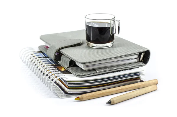 Black coffee on notebook — Stock Photo, Image