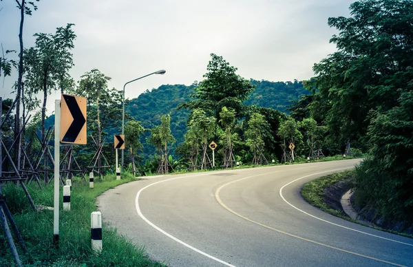 Curved road traffic sign — Stock Photo, Image