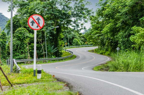 Snake curved road and warning sign — Stock Photo, Image