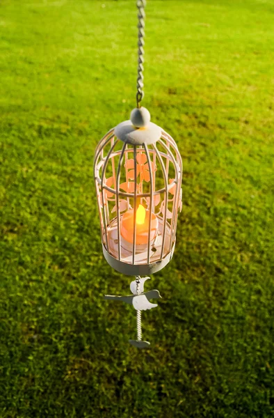 Imitation white candle in a cage. The decoration of the wedding — Stock Photo, Image