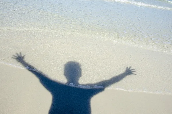 Shadow man on beach — Stock Photo, Image