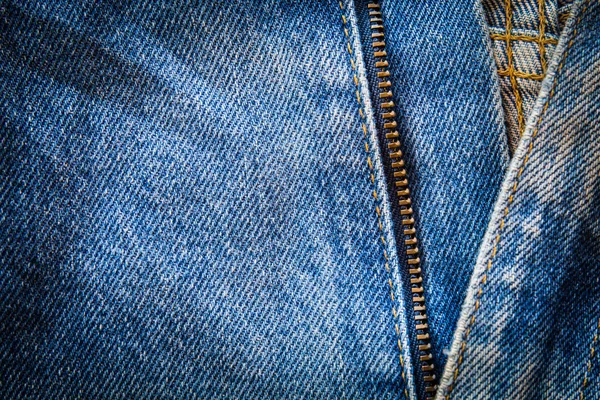 Close up of blue jeans fabric with seam and zipper. select focus — Stock Photo, Image