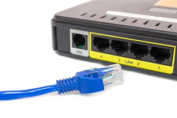 Close up LAN UTP RJ45 Cat5e In front of ADSL Router network switch — Stock Photo, Image