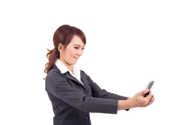 Young business woman holding cellphone on white background — Stock Photo, Image