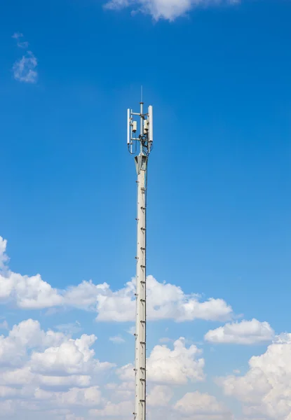 Communication antenna repeater tower on blue sky