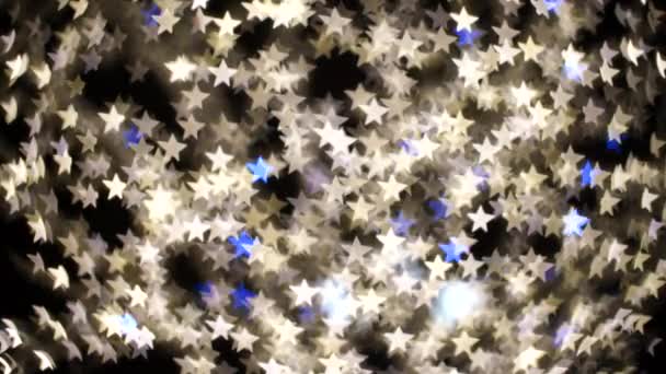 Vídeos de estrelas em borrão, eles piscam branco e azul. Iluminação festiva. — Vídeo de Stock