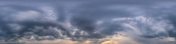 Blue evening sky seamless panorama spherical equirectangular 360 degree view with Cumulus clouds, setting sun. Full zenith for use in 3D graphics, game and aerial drone panoramas as sky replacement.